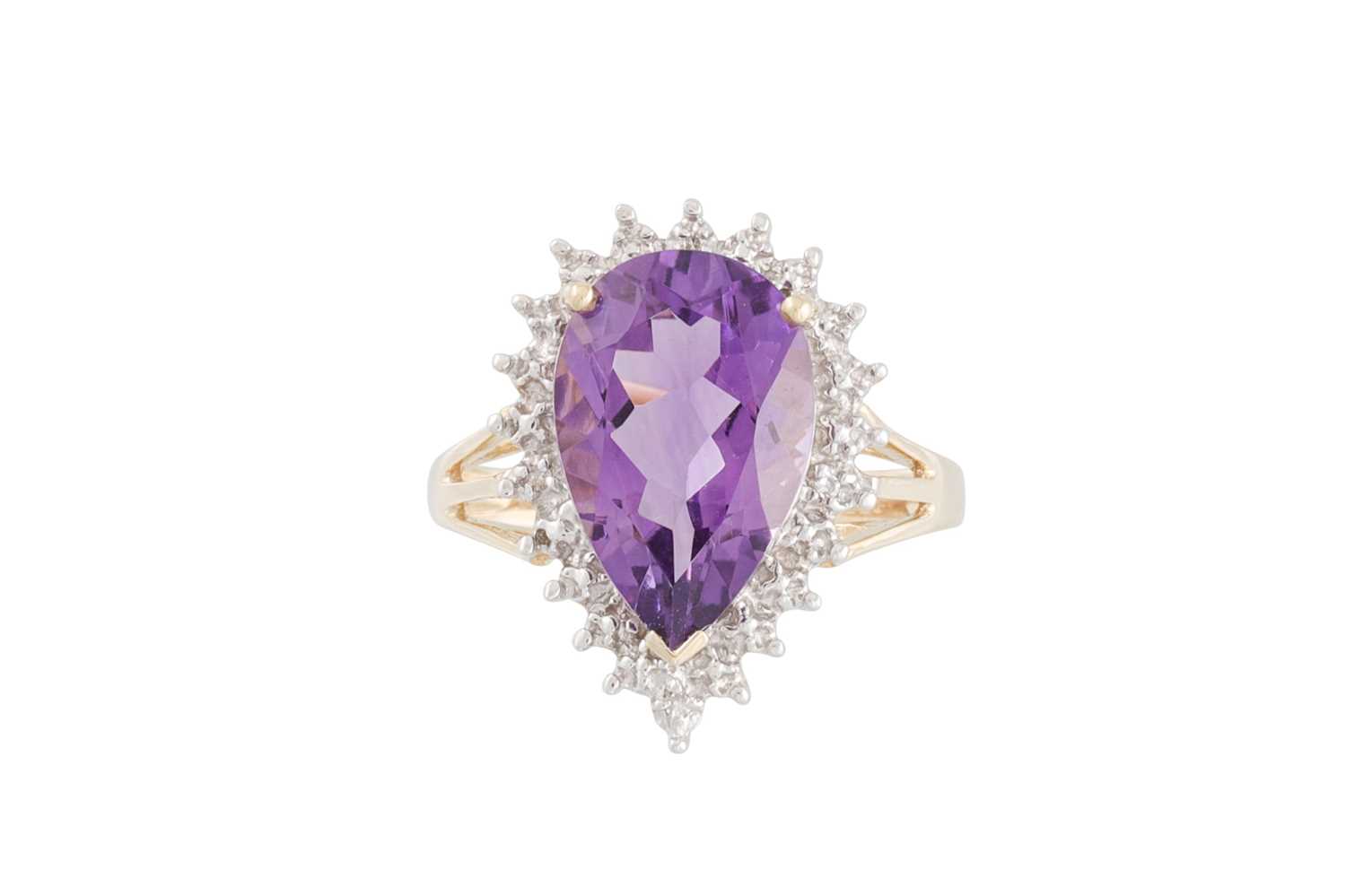 Lot 77 - A DIAMOND AND AMETHYST RING, the pear shaped...