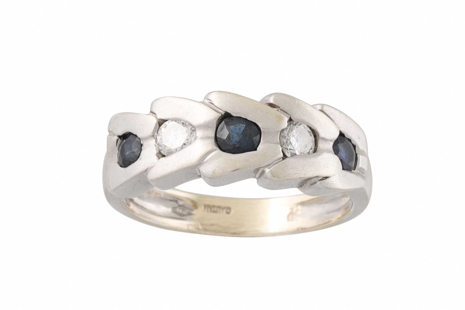 Lot 78 - A DIAMOND AND SAPPHIRE RING, set with three...