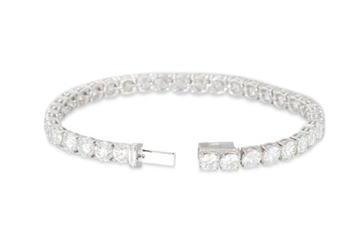 Lot 327 - A DIAMOND LINE BRACELET, the brilliant cut...