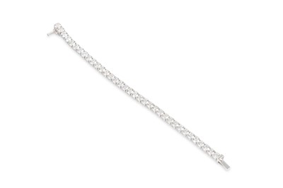 Lot 327 - A DIAMOND LINE BRACELET, the brilliant cut...