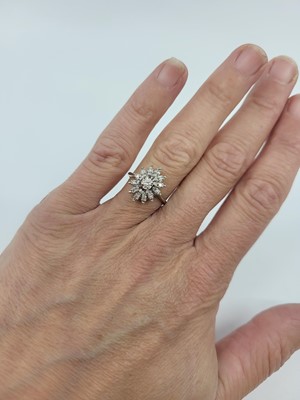 Lot 265 - A DIAMOND CLUSTER RING, mounted in 14ct white...