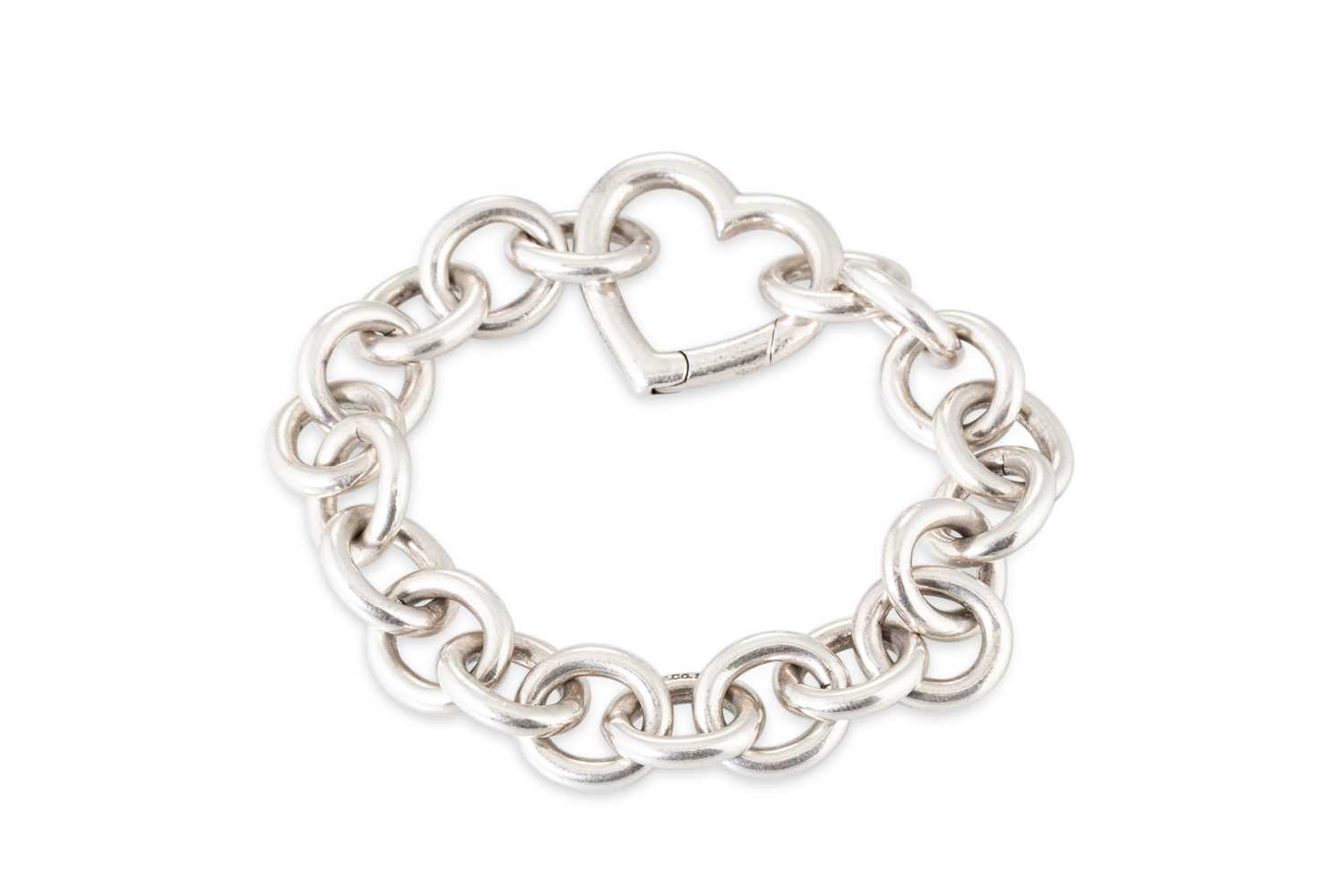 Lot 19 - A STERLING SILVER BRACELET, with heart work...