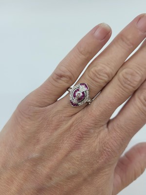 Lot 50 - A VINTAGE DIAMOND AND SYNTHETIC RUBY CLUSTER...