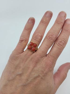 Lot 275 - A VINTAGE CORAL SET CLUSTER RING, the four...