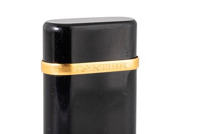 Lot 90 - A CARTIER BLACK ENAMEL LIGHTER, stamped...