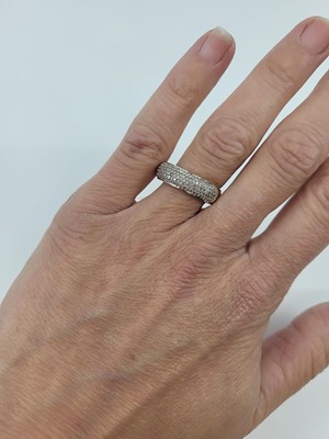 Lot 95 - A DIAMOND CLUSTER RING, the pavé diamonds...