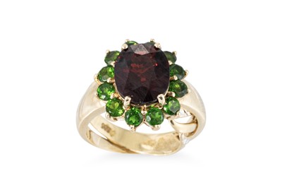 Lot 334 - A 9CT YELLOW GOLD GARNET AND GEMSET RING,...