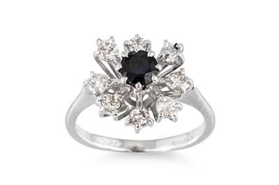 Lot 23 - A DIAMOND AND SAPPHIRE CLUSTER RING, the...