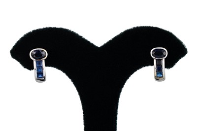 Lot 34 - A PAIR OF SAPPHIRE SET EARRINGS, the oval and...