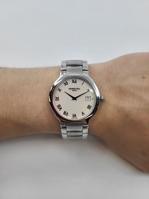 Lot 342 - A RAYMOND WEIL GENEVA WRIST WATCH, with date,...