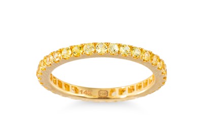 Lot 66 - A YELLOW SAPPHIRE FULL BANDED ETERNITY RING,...