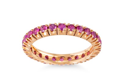 Lot 67 - A RUBY FULL BANDED ETERNITY RING, mounted in...