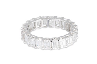 Lot 312 - AN EMERALD CUT DIAMOND FULL BANDED ETERNITY...