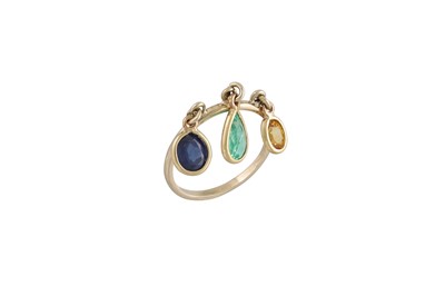Lot 257 - AN 18CT GOLD RING, suspending an emerald, a...