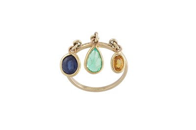 Lot 257 - AN 18CT GOLD RING, suspending an emerald, a...