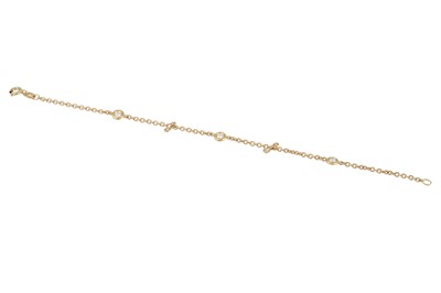 Lot 264 - A DIAMOND 18CT BRACELET, the collet set...