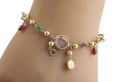 Lot 265 - A MULTI-GEMSET CHARM BRACELET, set with...
