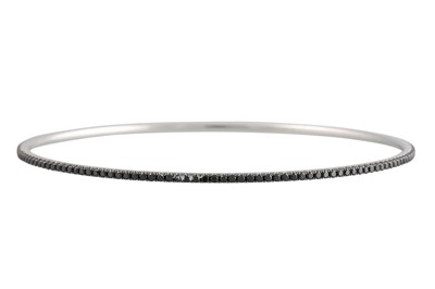 Lot 268 - A BLACK DIAMOND BANGLE, the circular diamonds...