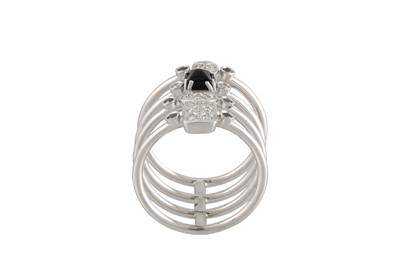Lot 275 - A DIAMOND AND SAPPHIRE LINK RING, in stack...