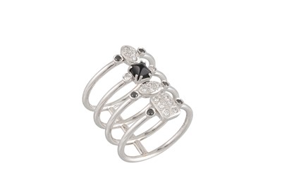 Lot 275 - A DIAMOND AND SAPPHIRE LINK RING, in stack...