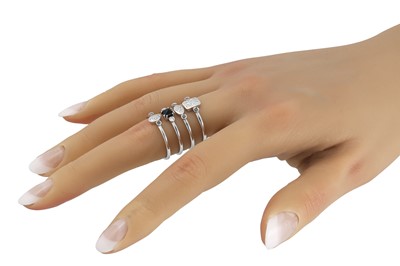 Lot 275 - A DIAMOND AND SAPPHIRE LINK RING, in stack...
