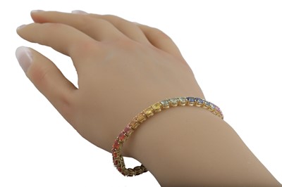 Lot 249 - A MULTI COLOURED SAPPHIRE LINE BRACELET, the...