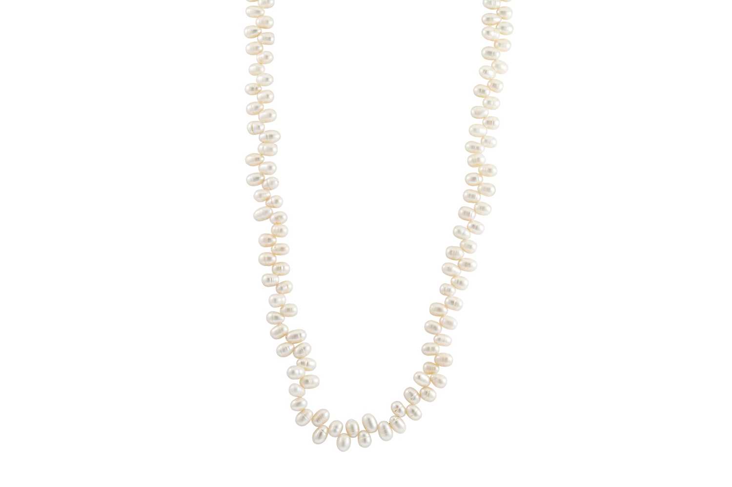 Lot 46 - A LONG CULTURED RIVER PEARL NECK LACE, silver...