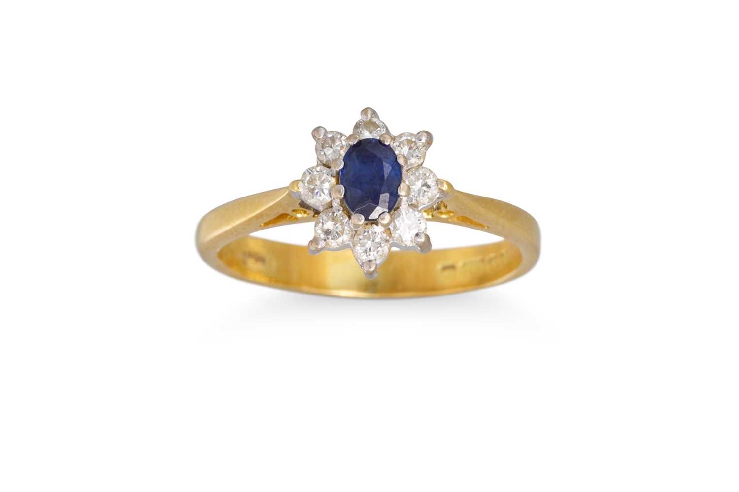 Lot 72 - A DIAMOND AND SAPPHIRE CLUSTER RING, mounted...