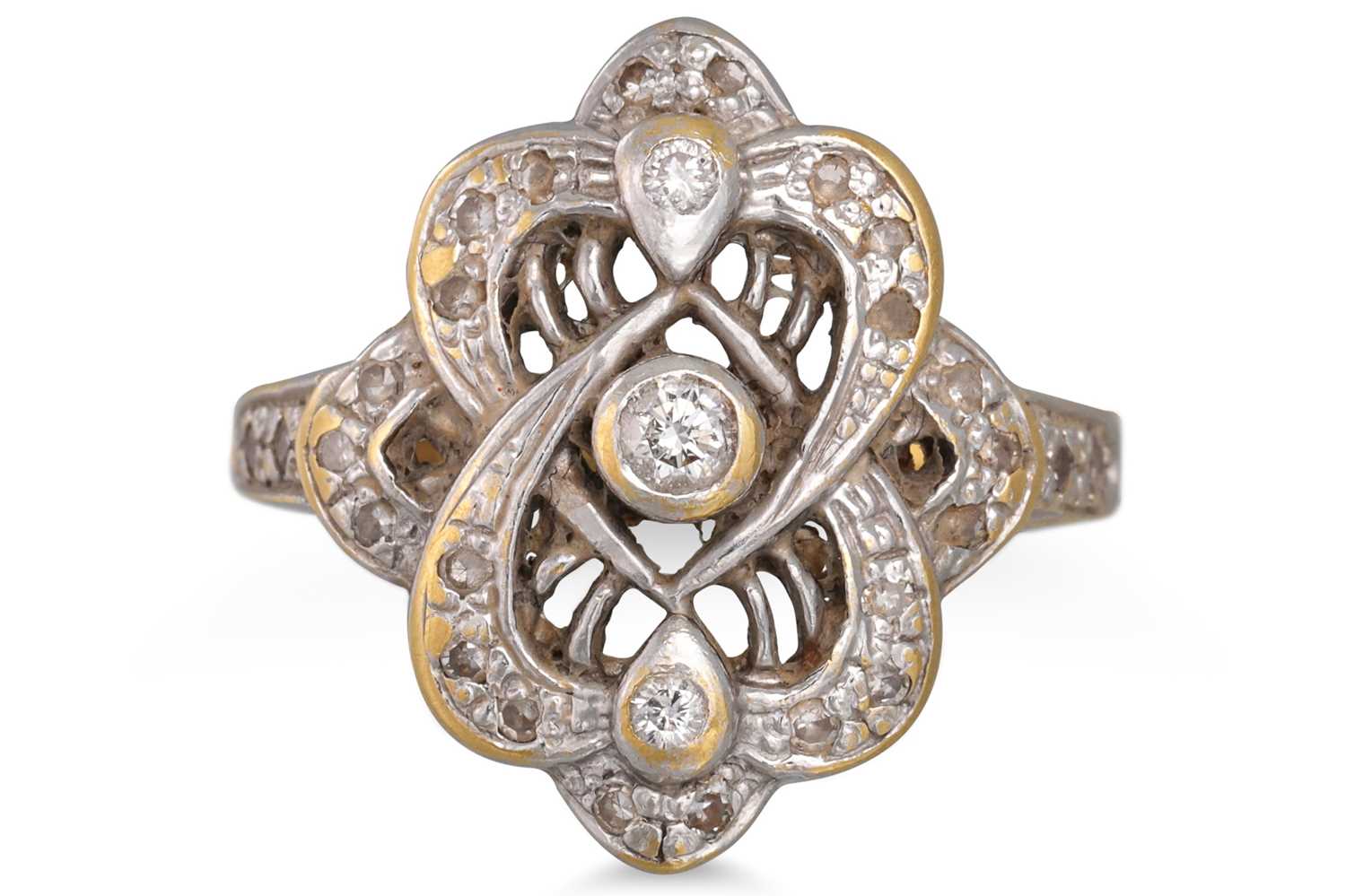 Lot 85 - A SHAPED DIAMOND CLUSTER RING, mounted in 18ct...