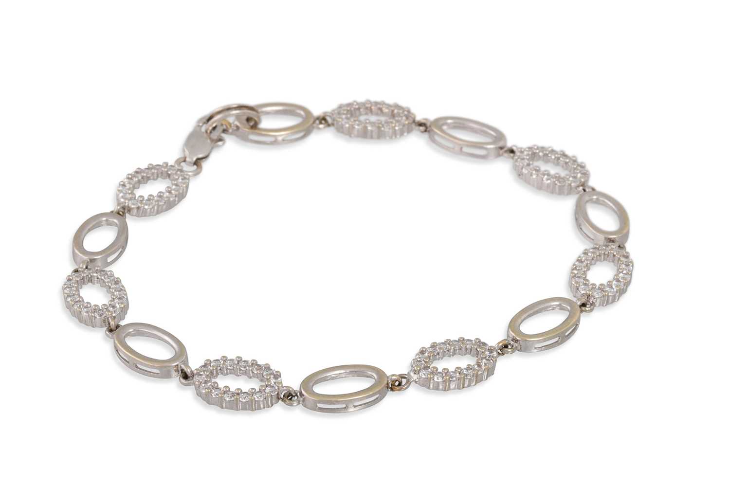 Lot 59 - A WHITE METAL STONE SET BRACELET, 6.7 g.